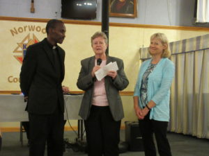 Father Jean Pierre thanks Reverend Carol Baker and her parish for their continued support